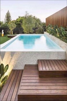 Terraced Patio Ideas, Raised Pools, Kleiner Pool Design, Pool Landscape Design, Above Ground Pool Landscaping, Small Pool Design, White Mosaic, Backyard Pool Landscaping, Above Ground Swimming Pools