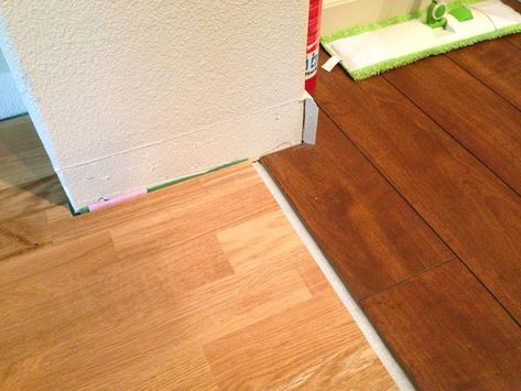 don't know if this will help with baseboard issue or not How to install baseboards over uneven floor levels? Floor Transition Ideas, Flooring Ideas Vinyl, How To Install Baseboards, Laminate Flooring In Kitchen, Floor Transition, Transition Ideas, Inexpensive Flooring, Transition Flooring, Transition Strips