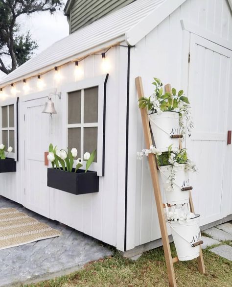 white painted shed with black edging, leaning ladder for plants // fort & field White Paint Black Trim, Shed Exterior Ideas, White Shed, Shed Exterior, Painted Shed, Shed Landscaping, Shed Makeover, She Shed Ideas, Garden Cabins