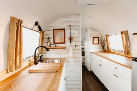 Photo 5 of 15 in A Beautifully Retrofitted 1969 Airstream Strikes a Chord With a Nashville Musician - Dwell Fold Out Table, Birch Cabinets, Airstream Remodel, Upper Kitchen Cabinets, Airstream Interior, Airstream Renovation, Hardwood Floors Dark, Vintage Airstream, Airstream Trailers