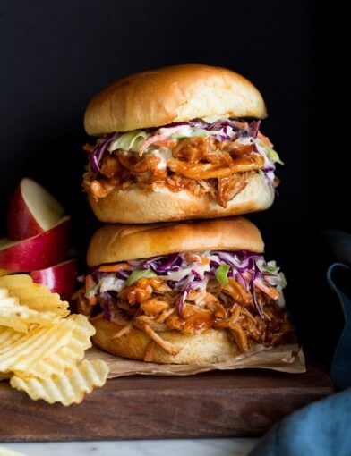 Hawaiian BBQ Pulled Chicken Sandwiches (Slow Cooker Recipe) - Cooking Classy Crockpot Bbq Pulled Chicken, Bbq Pulled Chicken Sandwiches, Bbq Pulled Chicken, Pulled Chicken Sandwiches, Slow Cooker Chicken Thighs, Bbq Chicken Sandwich, Bbq Chicken Crockpot, Chicken Crockpot Recipes Easy, Best Crockpot Recipes