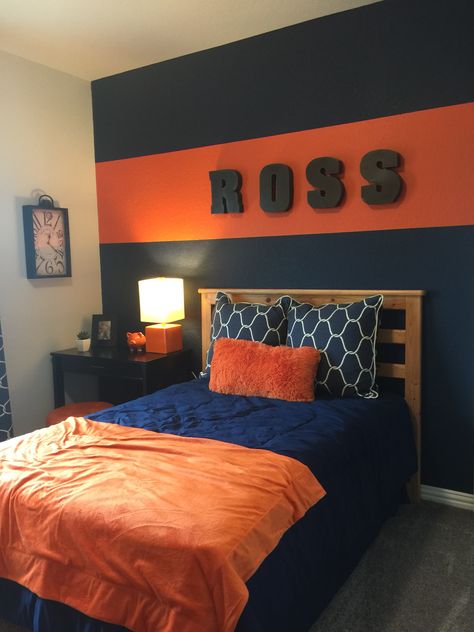 Oilers Room Ideas, Red Boys Bedroom Ideas, Boys Orange Bedroom Ideas, Teen Room Decor For Boys Small Spaces Bedroom Ideas, Orange Boys Bedroom, Navy And Orange Bedroom, Boys Room Paint Ideas, Orange Boys Rooms, Boys Bedroom Orange