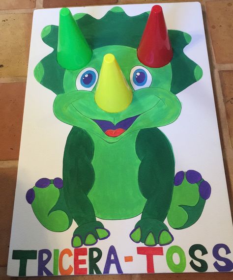 Triceratops Ring toss game for dinosaur bday party! Dino Toss Game, Triceratops Ring Toss Game, How To Make Dinosaur Party Hats, Feed The Trex Game, Three Rex Party Decorations, Dinosaur Party Ideas Activities, Dinosaur 3rd Birthday Party Games, Dinosaur Toss Game, Three Rex Birthday Activities