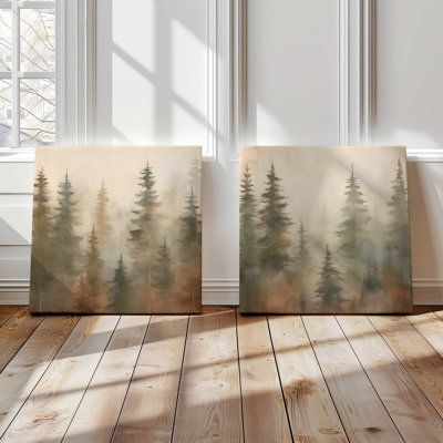 Create a serene backdrop in your space with the 'Foggy Warm Forest' art prints. This set of two features beautifully detailed pine forests, each tree fading into the misty background, all depicted in warm, earthy tones. These prints are perfect for anyone looking to add a touch of natural elegance and a peaceful vibe to their decor scheme. Millwood Pines Format: Wrapped Canvas, Overall Size: 16" H x 16" W x 1.25" D | Millwood Pines Foggy Warm Forest, Set of 2 Print on Canvas green / brownCanvas Bedroom Wall Art Ideas Paint, Mountain Home Decor Ideas, Family Photos Decor, Earthy Home Office, Forestcore Bedroom, Misty Forest Painting, Pine Painting, Pine Forest Painting, Cabin Update