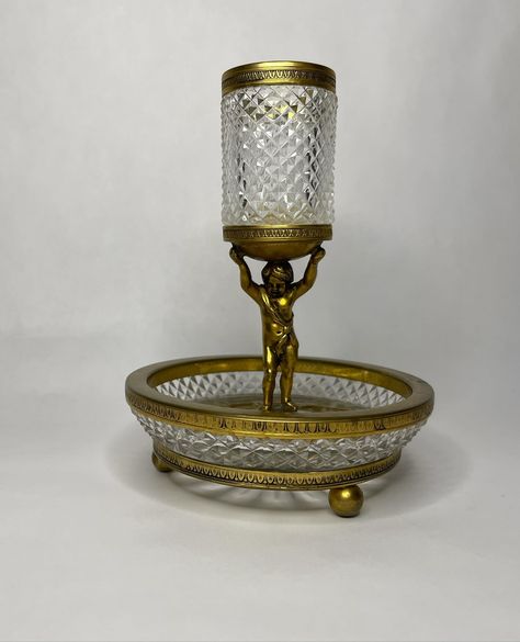 French Cut Glass & Ormolu Trinket Dish $125 + shipping base bowl: 5 1/2in D top cylinder: 1 1/2in D x 2 3/4in H 7 1/4in H Note: from my research this style could be for Cigarettes & an Ashtray or more likely a Jewelry Holder - Please read shop policies & how to shop in the highlights section of our page - All items are used, vintage or antique & will reflect that. Any major blemish will be noted when listed - All sales final - Prices do not include shipping & will be a separate cost ... French Cut, Jewelry Holder, Trinket Dish, Trinket Dishes, Cut Glass, Shop Policies, Highlights, Bowl, Glass