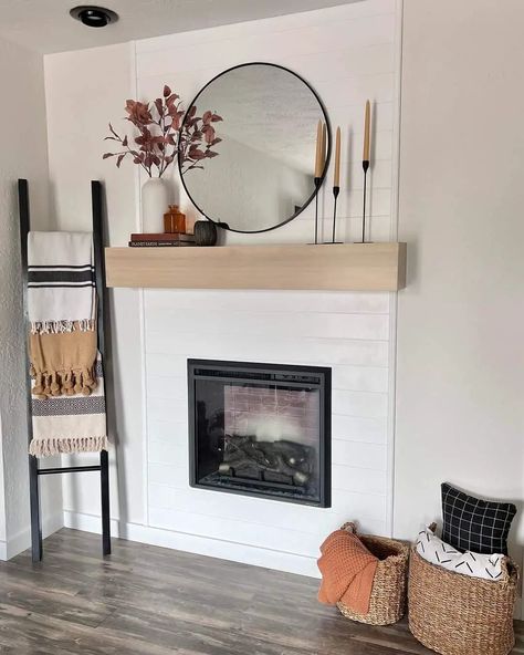 7 Modern Hearthless Fireplace Designs for a Sleek Farmhouse Living Room Black Blanket Ladder, Fireplace Without A Hearth, Decorating A Fireplace, Modern Farmhouse Mantle, Black Metal Mirror, Above Fireplace Decor, Farmhouse Chic Living Room, Mirror Above Fireplace, Grey Stone Fireplace