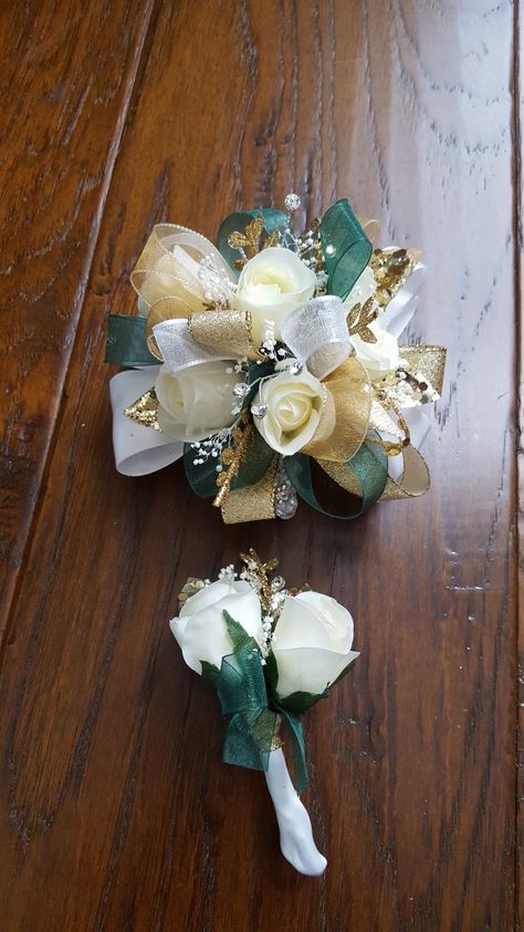 Emerald green and gold corsage set from Hen House Designs www.henhousedesigns.net Corsage And Boutonniere Set Green, Jade Green Corsage, Green And Gold Corsage Prom, Emerald Green And Gold Corsage, Green Prom Corsage And Boutonniere, Prom Corsage And Boutonniere Emerald Green, Prom Flowers Corsage Green Dress, Green White And Gold Bouquet, Emerald Green Bouquet Prom