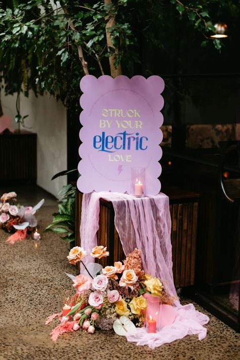 Ash & Joel Electric Love Wedding, Funky Wedding Reception, Maximalism Wedding, Disco Wedding Sign, Groovy Wedding Flowers, Electric Wedding, 70s Wedding Welcome Sign, Groovy Wedding Signage, Disco Floral Installation