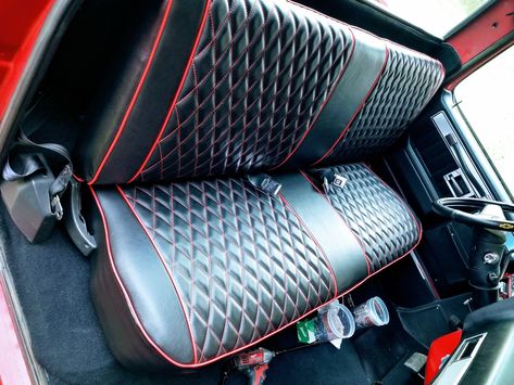 The diamond pattern and red stitching perfectly complements our classic black leather on this truck bench seat #customauto #leather #blackleather #customtruck #truck Squarebody Bench Seat, Bench Seat Upholstery Truck, Bench Seat Covers Truck, Truck Bench Seat Ideas, Fire Truck Room, 1956 F100, Truck Camper Shells, Car Paint Colors, Single Cab Trucks