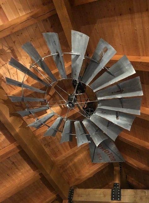 This is our 8' Replicated Vintage Aermotor Windmill Ceiling Fan with a new San Angelo Aermotor Vane (Tail) set up with our Open Box Design. This is a completely brand new windmill wheel and vane that we have distressed for a vintage look. Our Open Box Design allows you to see the belts and pulleys, giving it that old-fashioned appeal. Country Style Ceiling Fans, Barn Ceiling Ideas, Ceiling Fan Windmill, Ceiling Fan Vintage, Ceiling Fan Ideas, Old Ceiling Fan, Windmill Fan, Windmill Ceiling Fan, Rustic Ceiling Fan