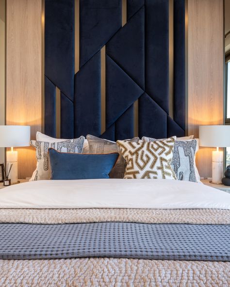 Our soft furnishings add an extra layer of comfort and luxury to this principal bedroom, while a chic chair from French designer @moustache_editions infuses the space with some Parisian flair. Photo credit: @tonymurraypho #dapaatelier #interiordesign #onethamesquay #bedroomdesign Parisian Chic Bedroom, Geometric Headboard, Blue Headboard, Texture Contrast, Sleek Desk, Chic Chair, Velvet Chair, French Designer, Parisian Chic