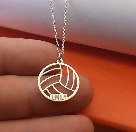 Sport Volleyball pendant in Sterling Silver number and name silver necklace , volleyball name  jewelry, silver sport number, sport mom gift VOLLEYBALL SIZE : 21 MM X 20 MM Metal: 925 Sterling Silver Thickness: approx. 1mm Chain: 925 Sterling Silver The Sport Volleyball Pendant in Sterling Silver is a stylish and personalized necklace that celebrates the passion for volleyball. This custom necklace features a volleyball pendant with the option to engrave a player's number and name, making it a pe Volleyball Necklace Jewelry, Volleyball Gift Ideas, Sport Jewelry, Volleyball Necklace, Volleyball Jewelry, Sports Mom Gifts, Volleyball Designs, Sport Mom, Sport Volleyball