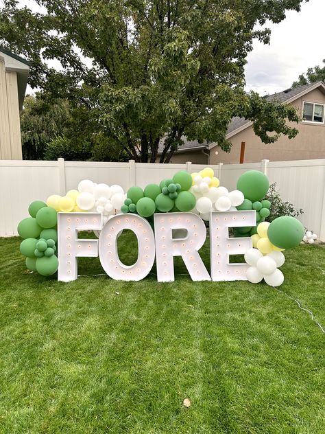 Green, white, and yellow balloons surrounding white marquee letters saying fore. Four Year Old Golf Party, Golf Fourth Birthday Party, Golf Fourth Birthday, Fore Birthday Boy Theme, Golf 4th Birthday Party, Boy Fourth Birthday Party Ideas, Fore Birthday Theme, Foam Board Numbers, Fore Party