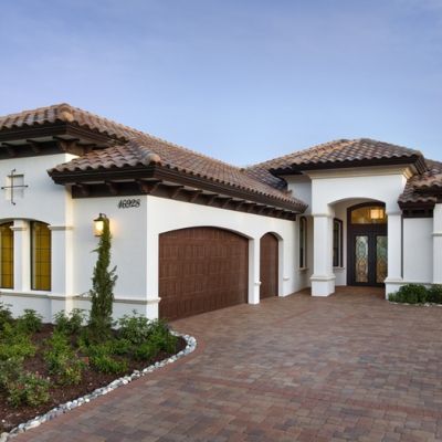 Lifestyle Homes | Harbourside Custom Homes Spanish Style Home Exterior, Spanish Style Exterior, Mediterranean Homes Exterior, Mediterranean Exterior, Exterior House Colors Combinations, House Paint Color Combination, Homes Exterior, Mediterranean House Plans, Spanish Villa