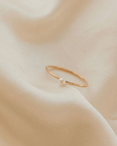 Our Pearl Ring is stunningly simple, and a staple piece for any wardrobe. This gold filled band ring features one of our pearls on an understated setting that completes the look. The Pearl Ring will live happily in your collection forever. Details: -Gold Filled -Size: 6, 7, 8, -Waterproof, Tarnish Free, Hypoallergenic Pearl Gold Rings For Women, Pearl Promise Ring, Dainty Pearl Ring, Simple Promise Rings, Dainty Promise Rings, Simple Pearl Ring, Pearl Promise Rings, Minimalistic Rings, Simple Promise Ring