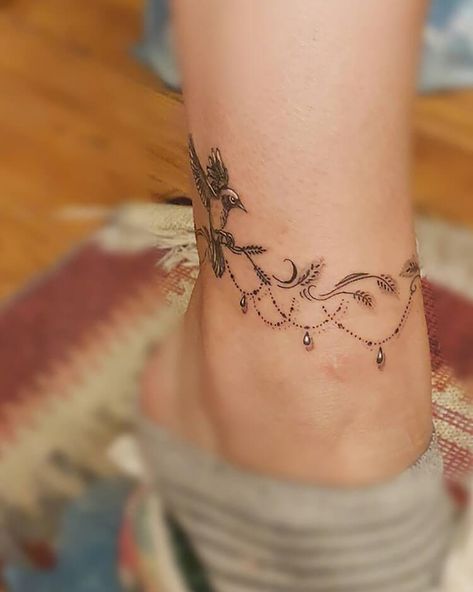 Ankle Bracelet with a Bird Design Jewellery Tattoo Design, Dragonfly Anklet Tattoo, Chain Bracelet Tattoo Wrist, Fine Line Anklet Tattoos, Ocean Anklet Tattoos For Women, Lace Anklet Tattoo, Tattoo Ideas Female Leg Ankle, Floral Ankle Bracelet Tattoo, Henna For Ankle