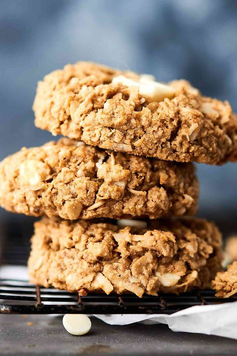 These Easy Coconut Oatmeal Cookies are gluten free and full of old fashioned oats, white chocolate, and sweetened coconut! Quick, easy, thick, chewy, and soooo warm and cozy! showmetheyummy.com #glutenfree #cookies #oatmealcookies #coconutoatmealcookies #whitechocolate Gluten Free Oatmeal Coconut Cookies, Coconut Oil Oatmeal Cookies, No Bake Cocoa Oatmeal Coconut Cookies, 4 Ingredient Crispy Coconut Oatmeal Cookies, Coconut Oatmeal Cookies Recipes, Oatmeal Coconut Chocolate Chip Cookies, Cherry Jelly Recipes, Coconut Oatmeal Cookies, Coconut Pecan Cookies