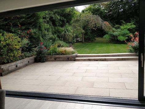 Large porcelain patio, oak sleeper retaining walls and new lawn in Sutton - Patio - Surrey - by Ayegardening Ltd | Houzz Sleeper Patio Ideas, Porcelain Patio, Sleeper Retaining Wall, Sleepers In Garden, Oak Sleepers, Patio Installation, Rustic Patio, Small Courtyard Gardens, Garden On A Hill