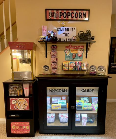 Basement Bar With Popcorn Machine, Cool Basement Decor, Movie Theatre Snack Bar, Popcorn Machine In Home Decor, Movie Theater Living Room, Popcorn Stand Ideas, Movie Cart, Home Theater Snack Bar Ideas, Movie Room Snack Bar