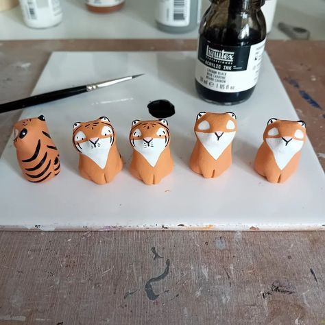 Some tiny tigers on the way...just adding the finishing touches 🐯 . . #clay #clayart #airdryclay #sculpture #claysculpture #artsandcrafts #animalart #pottery #potteryanimals #wildlife #animals #clayanimals #cute #cuteanimals #figures #figurines #ornaments #miniature #miniatures #miniaturesculpture #miniatureanimals #minis #totem #wildlifeart #workinprogress #etsy #etsyuk #fallingfauna Kids Clay Ideas, Air Dry Clay Figurine, Air Dry Clay Miniatures, Mini Clay Figures, Air Dry Clay Animals, Clay Tiger, Mini Animals, Kids Clay, Pottery Animals