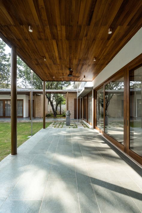 Lenka House | Khosla Associates – architecture + interiors Khosla Associates, Polished Cement, Double Height Living Room, Boundary Walls, Yellow Doors, Beige Marble, Village House, House Front Design, Village House Design