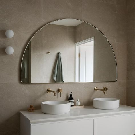 A moment for our Studio XL Wide Wall Arch Mirror, Brass - featured in @villa_cascata bathroom earlier this year. 🫶 #BathroomDesign #CustomMirrors #BathroomDecor #BathroomInspo #LuxuryBathroom #MirrorDesign #BathroomStyling #HomeSpa #BathroomGoals #BathroomRenovation #InteriorDesign #BathroomIdeas #CustomBathroom #VanityMirror #MirrorGoals #ModernBathroom #HomeDecor #BathroomInspiration #DesignerBathroom #BathroomVibes #InteriorInspo #BathroomStyle #MirrorMagic #StylishBathroom #BathroomMakeover Wide Arch Mirror Bathroom, Wide Arch Mirror, Studio Mirrors, Arch Mirror Bathroom, Arch Mirrors, Studio Mirror, Wall Arch, Powder Room Mirror, Unique Homewares