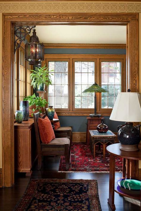 Navy-blue walls work in the bright sunroom; the table lamp by the window is by Century Studios. Craftsman Interior Design, Craftsman Interiors, Craftsman Home Interiors, Arts And Crafts Interiors, Craftsman Interior, Minimalist Living Room Decor, Arts And Crafts House, Craftsman Style Homes, Craftsmen Homes