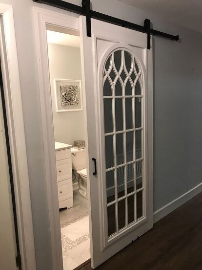 Learn how to build a rustic farmhouse for cheap. Check out these 17 ideas for how to build an inexpensive sliding barn door. Save space in your home with sliding barn doors hardware and tutorials. Cathedral Mirror, Mirror Barn Door, Fixer Upper Bathroom, Small Hall, Diy Bird Feeder, Interior Barn Doors, Joanna Gaines, Barn Door Hardware, Barnwood