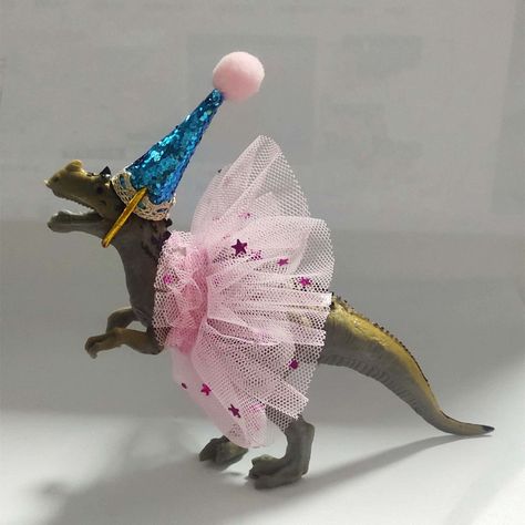 PRICES MAY VARY. ✨The allosaurus dinosaur cake topper included:1pcs x allosaurus dinosaur, 1pcx party animal hats, 1pcx handmade tutu dress . Size is same as picture. Handmade products cannot be 100% perfect. If you are very strick with the quality, pls thick twice before ordering. ✨Material: the allosaurus dinosaur with tutu and party hat cake topper are made of non-toxic plastic and BPA-free material, safe for children. The cute unique party dinosaur figures with tutu is solid with hand-made c Animal Party Cake, Jungle Dinosaur, Plastic Animal Crafts, Dinosaur Cupcake Toppers, Dinosaur Cake Topper, Dinosaur Cupcakes, Dinosaur Birthday Party Decorations, Dinosaur Cake Toppers, Tutu Party