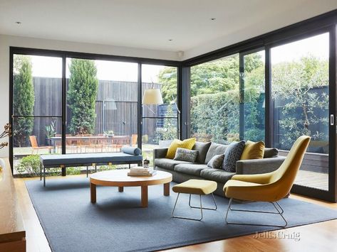 Living room with large windows leading out to the backyard - Melbourne Aus. Large Windows Living Room, Big Windows Living Room, Beautiful Dining Rooms, Modern Houses Interior, Big Windows, Living Room Windows, Holiday Inn, Open Plan Living, Living Room Interior