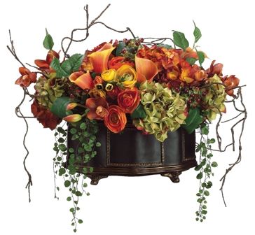 A blend of bright, colored flowers with twig and vine accents creates an organic look. Ranunculus Arrangement, Yellow Hydrangea, Silk Wreaths, Silk Arrangements, Fall Flower Arrangements, Faux Hydrangea, Fall Arrangements, Silk Flower Arrangements, Faux Florals