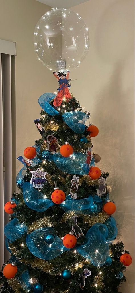 Dragon ball Z themed christmas tree Dragon Ball Tree, Dbz Christmas Tree, Anime Christmas Tree Ideas, Dragon Ball Z Decor, Dragon Ball Christmas Tree, Sonic The Hedgehog Christmas Tree, Studio Ghibli Christmas Tree, Dragon Ball Z Decorations, Dragon Ball Z Christmas Tree