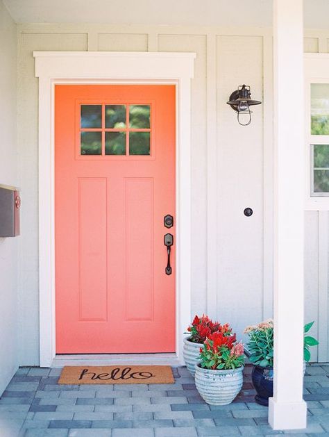 Coral Front Door / Another option for those who really want to go all-in, repainting your front door in ‘Living Coral’ will give new life to the front of your home. Complete this look with a cute wreath! / Living Coral was named as Pantone’s 2019 Color of the Year! Here are 8 ways to add a dose of this chic, cheerful hue into your life. / theanastasiaco.com Peach Door Exterior, Peach Front Door, Peach Door, Orange Front Door, Coral Front Doors, Coral Door, House Magic, Cottage Front Doors, Pink Front Door