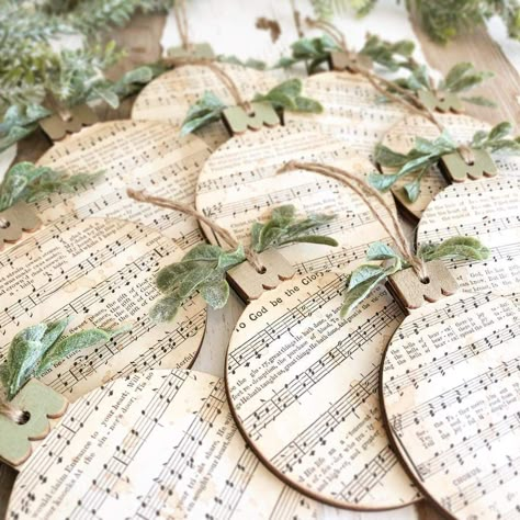 Song Sheet Crafts, Diy Ornaments Farmhouse, Hymn Ornaments Diy, Hymn Christmas Ornaments, Round Flat Christmas Ornaments, Craft With Sheet Music, Musical Ornaments Diy, Decorating With Sheet Music, Christmas Music Decorations