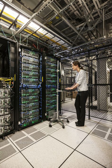 Caucasian woman technician working on computer servers in a server farm. by Mint_Images. Caucasian woman technician working on computer servers in a server farm. #Sponsored #technician, #working, #Caucasian, #woman Server Farm, Working On Computer, Computer Server, Mint, Computer, Quick Saves