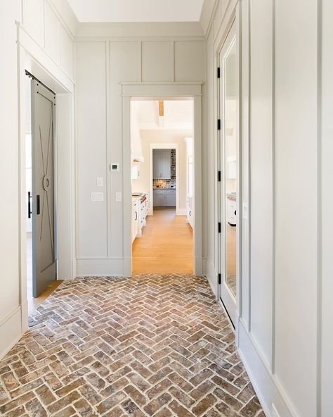 Brick Chevron Floor, Brick Flooring In Mudroom, Fireplace In Hallway, Brick Foyer, Brick Hallway, Brick Floors Mudroom, Herringbone Brick Floor, White Hallway, Church Interior Design