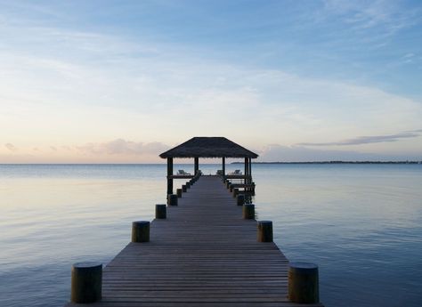 Placencia Peninsula, Belize - Best Beach Getaways Beyond Tulum | Jetsetter Ocean Reflection, Beach Dock, Belize Honeymoon, Placencia Belize, Belize Vacations, Latin America Travel, Lake Dock, Dock Lighting, Belize City