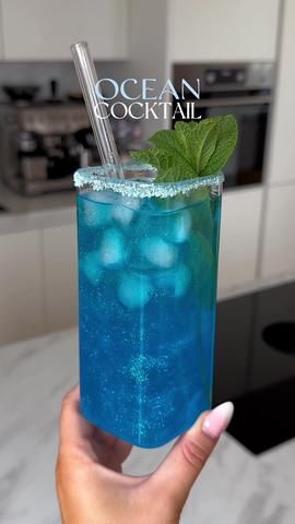 WHITE SANGRIA - perfect for Mother’s Day! #whitesangria #sangria #san... | White Sangria Recipes | TikTok Blue Alcoholic Drinks For A Party, Blue Curacao Recipe, Ocean Cocktail, Blue Alcoholic Drinks, Cosmopolitan Cocktail Recipes, Blue Drink, Frozen Cocktail Recipes, Iced Drinks Recipes, Pretty Alcoholic Drinks