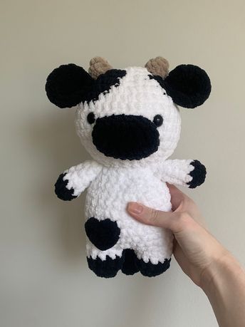 Handmade crochet black and white cow! This measures up to be 10.5 inches tall and 7.5 inches wide. Please note that this is not recommended for children under 3 because of the use of safety eyes. Not intended for rough play. Pattern by rin.meow21 Crochet Black And White, Black And White Cow, Crochet Black, White Cow, Knitting Bags, Safety Eyes, Knitted Bags, Handmade Crochet, Cow