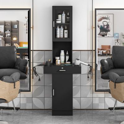 Stow all your haircut equipment with this functional barber station and say goodbye to the jumble. The black free-standing design is a great addition to any salon or room. Two upper storage cubbies with glass doors can keep the items inside orderly and clearly-seen, while the tabletop is equipped with round sleeves to hold flat irons, curling irons, hair dryer, and hair spray. The lockable drawer and bottom cabinet provide secret rooms for your big and important belongings. | Jaxpety Hair Tool H Salon Tools Hairdresser, Primitive Hair Salon, Hair Color Creative Storage, Hair Salon Shoe Box, Hair Salon Space Dividers, Hair Salon Coat Rack, Home Hair Salon Shampoo Station, Small Hair Salon Storage, Hair Appliance Storage With Power Outlet