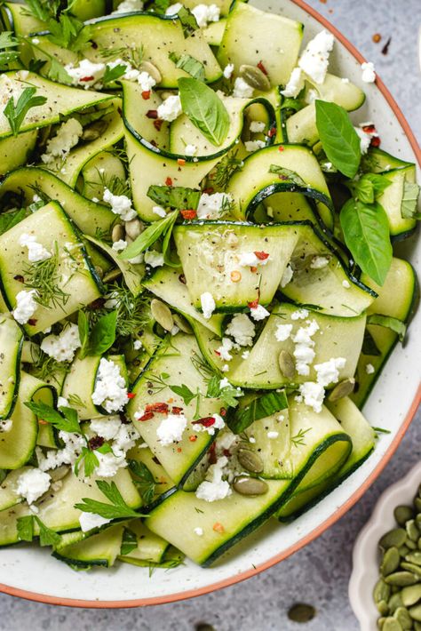 Zucchini ribbon salad in a serving bowl topped with herbs and feta cheese. Zucchini Ribbon Salad, Mediterranean Tomato, Herbed Potato Salad, Soup And Salad Combo, Tomato And Cucumber Salad, Ribbon Salad, Healthy Vegetarian Breakfast, Tomato And Cucumber, Week Meals