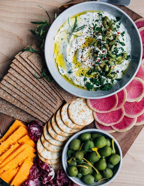 Don’t forget the appetizers! This light, tangy whipped goat cheese dip is a lovely addition to a festive holiday snack board. This delicious chèvre dip comes together in minutes and can be made up to three days ahead of time. My Thanksgiving prep is officially underway. I’ve been to the grocery store twice already and […] The post Whipped Goat Cheese Dip with Herbs and Olives appeared first on Brooklyn Supper. Whipped Goat Cheese Dip, Goat Cheese Dip, Simple Appetizer, Whipped Goat Cheese, Garlic Scapes, Vegan Roast, Summer Appetizer, Cheese Dip, Cured Meats