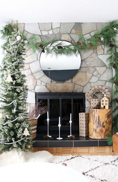 No mantle? No worries! You can still cozy up next to your fresh and inviting fireplace this holiday season with these simple steps. #["Christmas", "How-To", "holiday decor", "scandinavian", "rustic", "decorating", "living room", "accessories", "decor", "featured", "Holiday", "fireplace", "mantle", "inexpensive"] Christmas Fireplace With No Mantle, Christmas Decor Fireplace No Mantel, Christmas Decor Without A Mantle, Fireplace With No Mantle Decor, Fireplace No Mantle Decor, Decorating Fireplace Without Mantel, Christmas Fireplace Without Mantle, Fireplace Without Mantle Christmas, No Mantle Fireplace Decor