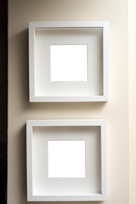 Two empty square neutral colored frames hanging together on an off white wall one below the other - free stock photo from www.freeimages.co.uk Empty Picture Frames, Off White Walls, Empty Frames, Photo Frame Design, Monogram Logo Design, Phone Wallpaper Design, Portrait Frame, Square Frames, Frame Design