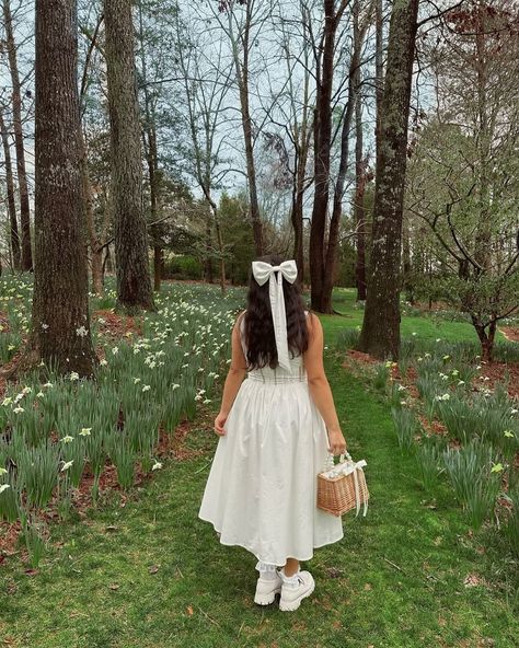 @valerie_mcpherson is wearing a new bigger bow size from my new bridal range, coming soon! There are three tail lengths to choose from although as I sew every piece in house, everything can be customised 🎀 Image description – Valerie is wearing a white dress and white silk hair bow in her long dark hair, facing away from the camera in a green woodland area #HairBow #RomanticStyle #GirlyAesthetic White Dress With Hair Bow, Feminine White Dress With Bow, White Bow In Hair, White Dress Bow, Hair Bow Veil, White Hair Bow Aesthetic, White Bow Hair Accessories As Gift, Silk Hair Bow, Classic Bridal Hair