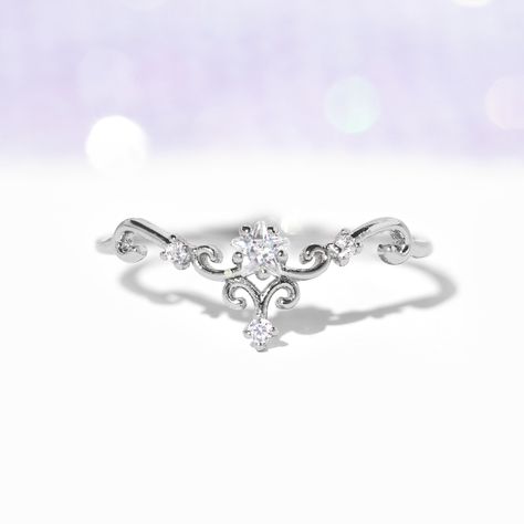 Looking for a ring that's equal parts elegant, unique, and cute? Your wish is our command. The beautiful curves and intricately placed crystals add a level of trendy opulence to this piece. Wear this stunner of a ring alone or with your other favorite Girls Crew pieces! Small Oval Promise Ring, Crown Wedding Band Princess Cut, Promise Rings Unique Vintage, Simple Cheap Wedding Rings, Small Dainty Engagement Rings Silver, Simple Wedding Rings For Women, Silver Vine Ring, Elegant Promise Rings, Weddings Rings Silver