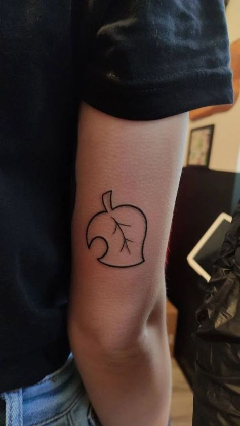 Simple Animal Crossing Tattoo, Animal Crossing Leaf Tattoo, Animal Crossing Tattoo Ideas, Acnh Tattoo, Cozy Tattoo, Animal Crossing Tattoo, Animal Crossing Tattoos, Cutesy Tattoos, Nerd Tattoos