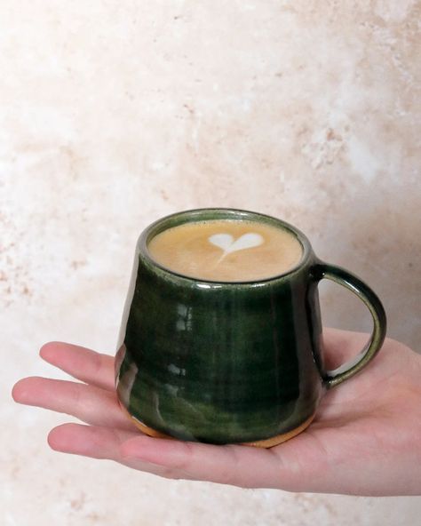 Morning coffee in a forest green mug. I love this glassy green celadon glaze, slightly transparent to show off the texture of the clay body, and glowing in the morning sun. My latte art skills leave a lot to be desired however, slightly shameful for this former barista. ☕💚☀️ #ceramicsofinstagram #potteryuk #mug #coffeegram #ihavethisthingwithceramics #coffeetime #functionalceramics Pottery Mug Glaze Ideas, Matcha Mug, Mugs Green, Celadon Glaze, Green Mug, Art Skills, Green Mugs, Clay Mugs, Morning Sun