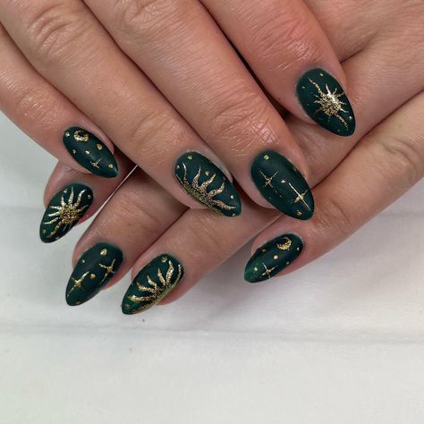 Dark Green Nails with Sun, Moon, and Stars Nail Inspo Celestial, Dark Moon Nails, Sun On Nails Art Designs, Gold And Forest Green Nails, Dark Green Nails Gold Accent, Day And Night Nail Art, Halloween Celestial Nails, Blue Gold And Black Nails, Dark Green Celestial Nails