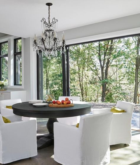 Low Back White Slipcover Chairs with Round Dark Stained Table - Transitional - Dining Room Dining Table In Front Of Patio Doors, Chartreuse Pillows, Glass Door Patio, Slipcover Chairs, Modern Glam Dining Room, White Slipcovered Chair, Deck Extension, White Slipcover, Glam Dining Room